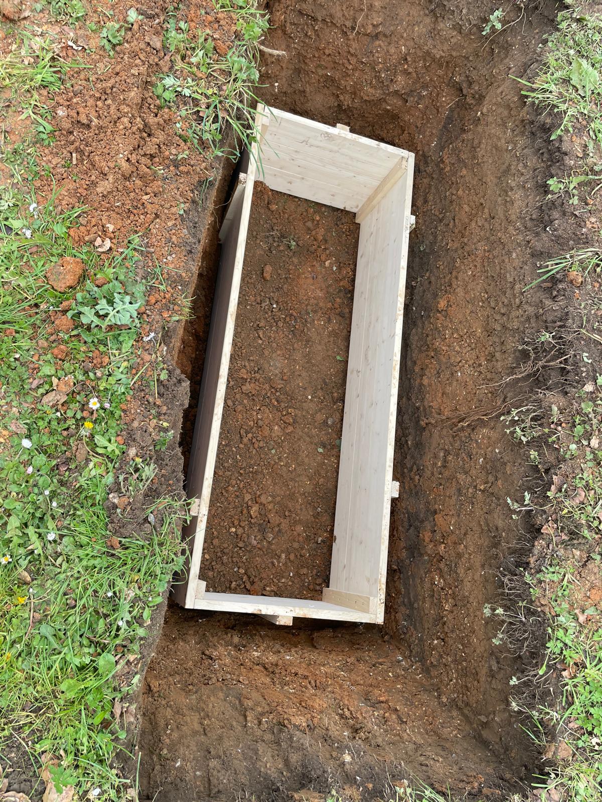Eco-friendly untreated timber burial box in a grave at The Avenue Cemetery
